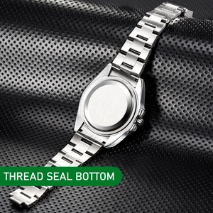Macro shot of stainless steel watch back case with thread seal and metal link bracelet