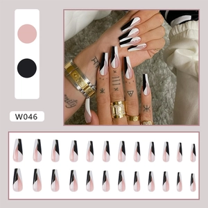 Detail view of W046 long coffin press on nails featuring black and pink geometric design