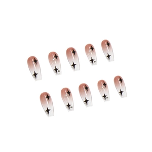 Pink gradient coffin press-on nails with black star prints and tiny diamond accents