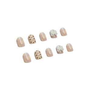 Pink press-on nails set with cute heart patterns and 3D white bows in diagonal layout