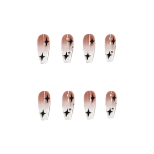 Star pattern press-on nails with nude pink gradient finish and sparkling silver rhinestones