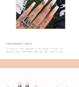 Macro view of long ballet press on nails with black butterfly and star patterns