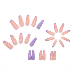 Press on nails in purple french coffin style with sparkling colorful rhinestones