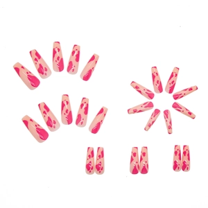 Glossy pink cow print long ballerina press-on nails set displayed on white background