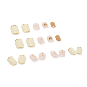 Short square press-on nails set in cream yellow and brown with cute bear designs