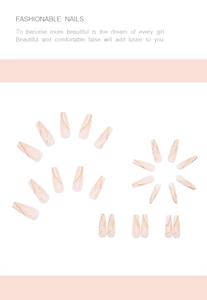 Detail of nude pink coffin press-on nails with golden marble texture and art patterns