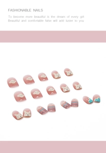 Detail of pink gradient press-on nails with cute hand-painted puppy and cloud patterns