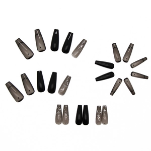 Glossy long coffin press on nails in black, translucent grey, and silver glitter finish