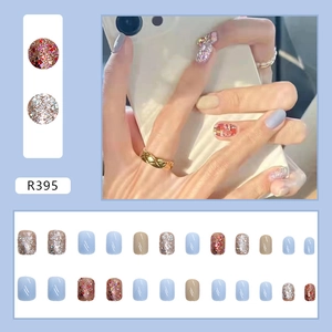 Short square light blue and champagne press-on nails with glitter and rhinestone details