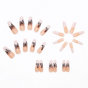 Long coffin press on nails featuring nude pink French tips and delicate black butterfly art