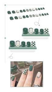 Close-up of green checkerboard press-on nails set with French dots and minimalist styles