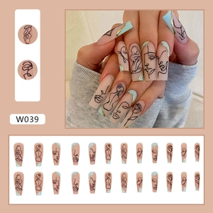 Long coffin false nails with nude pink base, abstract face lines and blue accents