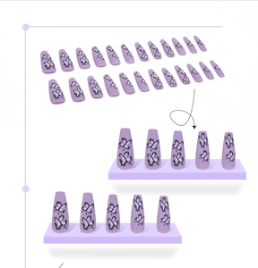 Detailed view of long coffin press-on nails with purple matte finish and butterfly patterns