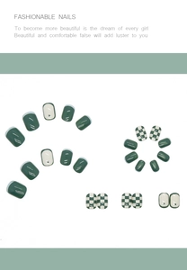 Detail view of green checkerboard press-on nails in short square shape and solid colors