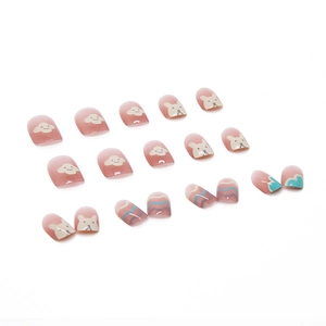 Pink gradient press-on nails featuring cute hand-drawn cartoon dog patterns and wavy lines