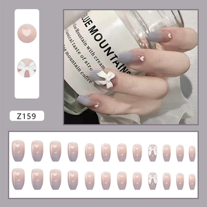 Detail view of 24pcs long coffin gradient press-on nails with 3D bows and heart patterns