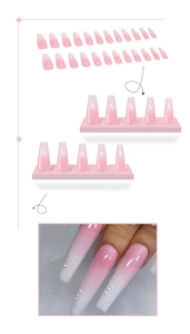 Detail of gradient pink pearl press-on nails with rhinestone accents on white backdrop
