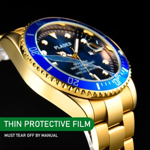 Detail of gold quartz diver watch featuring a navy blue dial and luminous markers