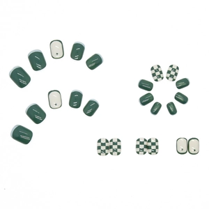 Glossy green checkerboard press-on nails set with solid dark green and polka dot designs