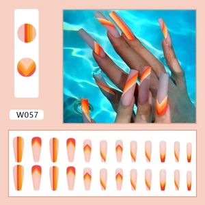 Matte long ballerina press-on nails with orange and yellow geometric line patterns