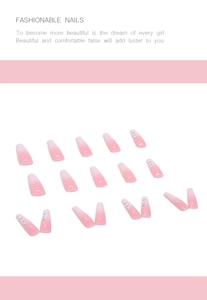 Detail of pink gradient coffin nails featuring micro rhinestones on a clean background