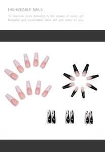 Detailed view of black and white Tai Chi coffin nails and French manicure press-on set
