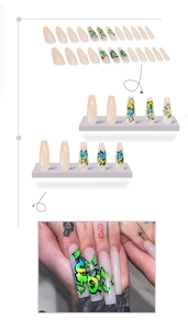 Detail of coffin-shaped press-on nails featuring punk graffiti art and dollar signs
