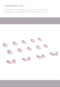 Detailed view of ombre press-on nails with 3D white ribbon bow and elegant gradient finish