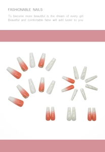 Detailed view of long coffin press-on nails with pink marble gradient and rhinestones