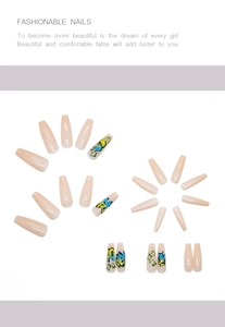 Detail of long coffin press-on nails featuring pink gradient and colorful punk graffiti art