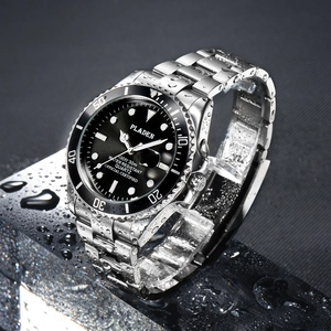 Close-up of luxury dive watch with water droplets on black dial and silver band
