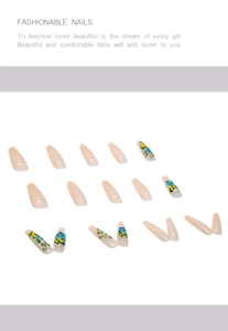 Detail view of long coffin nails with blue and yellow graffiti patterns on nude base