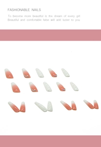 Detailed set of white ombre press-on nails with small rhinestone accents and almond shape