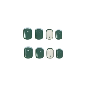Glossy green checkerboard press-on nails with white accents and black polka dot pattern