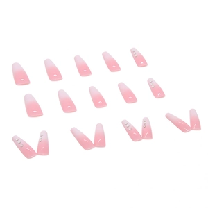 Pink gradient long ballerina press-on nails with rhinestone accents on white background