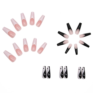 Extra long French style press-on nails featuring black and white Tai Chi and pink designs