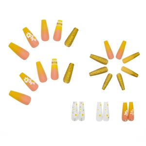 Yellow gradient press-on nails with daisy flower patterns and glitter rhinestone accents