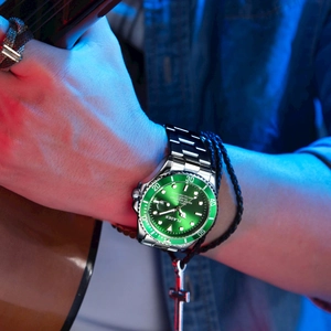 Men's green quartz diver watch with luminous dial shown in a creative music scene