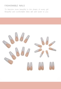 Detailed view of long coffin press-on nails with nude pink base and silver glitter French tips