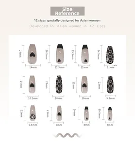 Size chart showing 12 long black heart checkerboard press-on nail dimensions in mm