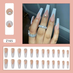 Long coffin press-on nails with silver glitter French tips and rhinestone accents
