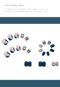 Detail of matte blue and pink press-on nails with hand-painted heart and smiley designs