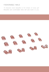 Detailed view of French gradient press-on nails in jelly bean red with 3D bow accent