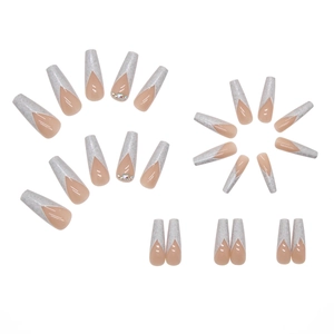 Long ballerina press-on nails with nude pink base and silver glitter V-shape French tips