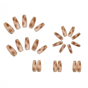 Glossy amber tortoiseshell press-on nails in long coffin shape with marble texture