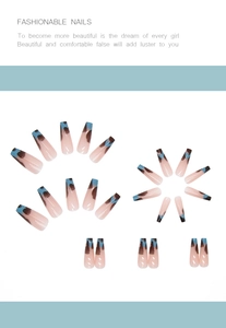 Macro view of long coffin press-on nails with nude pink base and blue ink splash patterns