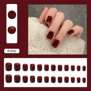 Detail of burgundy press-on nails set R306 with silver glitter edges and 24 pieces