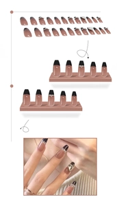 Detail of French press-on nails with black tips, rhinestones and heart charms