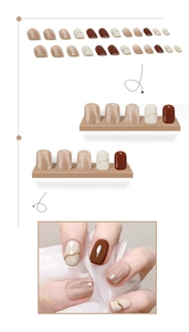 Macro detail of nude marble and deep red press-on nails with golden line accents