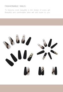 Detail of long coffin press-on nails with golden butterflies, rhinestones and glitter
